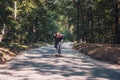 Longboard skating - Skateboarder ride a longboard through the forest