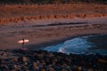 Longboard surfing. Woman surfing during amazing sunset. Midnight sun in Lofoten Islands, arctic surfing Royalty Free Stock Photo