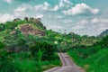 Automobile on a longer section of a disappearing rural road Ekiti State Nigeria. Disappearing road 