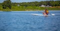 Longhaired girl paddles across pond in Martha`s Vineyard.jpg