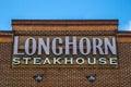 LongHorn Steakhouse building sign with blue sky and clouds Royalty Free Stock Photo