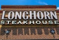 LongHorn Steakhouse building sign looking up close up view Royalty Free Stock Photo