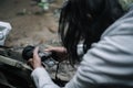 a longish man is focused on photographing a moment