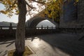 Longmen Bridge and autumn maple tree in the early morning, Yi River, Luoyang, Henan, China Royalty Free Stock Photo