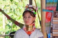 LONGNECK KAREN VILLAGE, THAILAND - DECEMBER 17. 2017: Close up of long neck girl with Thanaka face painting and brass neck coil