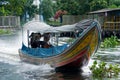 Longtail boat on a canal in Bangkok, Thailand