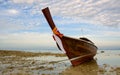 Longtail boat in low tide Royalty Free Stock Photo