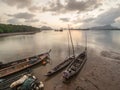 Longtail boat and sunrise at Samchong-tai, Phananga, Thailand. Royalty Free Stock Photo