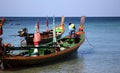 Longtail boat in Thailand with the captain.