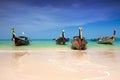 Longtail boats moored by the shore of Thailand Royalty Free Stock Photo