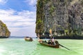 Longtail boats with tourists near famous place in Phang Nga bay near James Bond island, Phuket. Royalty Free Stock Photo