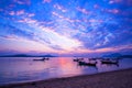 Longtail boats with Travel boats in tropical sea Beautiful scenery morning sunrise or sunset sky over sea and mountain in phuket Royalty Free Stock Photo