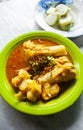 Lontong Kikil, a traditional food from Surabaya, East Java, Indonesia, made from curried cow\'s leg skin