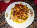 lontong opor ayam, Indonesian dish served on a plate