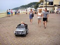 Loo Sochi, Russia, 08.31.2017: A little blond boy rides an electric car for the first time