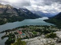 A look above on the town of Waterton on a dark cloudy day, at the top of bear`s hump trail