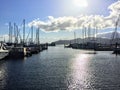 A look at a beautiful Marina in Gibsons, British Columbia, Canada.The docks are full of sailboats and the sun glimmers Royalty Free Stock Photo