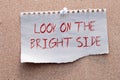 Look on the bright side advice or reminder - sticky note on a clipboard with a cup of tea Royalty Free Stock Photo