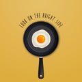 Look on the bright side - background with quote and fried egg illustration on a black pan. Royalty Free Stock Photo