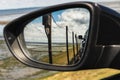 Look in a car mirror on the car train to the island sylt, germany. Royalty Free Stock Photo