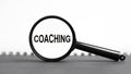 look closely and Coaching with a magnifying glass. business concept. magnifying glass on the white background Royalty Free Stock Photo