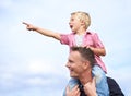 Look dad. A handsome father carrying his son on his shoulders. Royalty Free Stock Photo