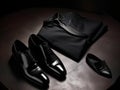 A perfectly tailored tuxedo paired with shiny black dress shoes created with Generative AI