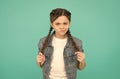 Look of discontent. Unhappy girl with braided hairstyle. Beauty look of little child. Casual fashion look. Trendy style