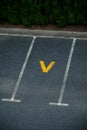 Look down empty parking spot with vegetation Royalty Free Stock Photo