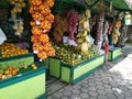 look at fruit shop that sells various kinds of fruit such as oranges,banana,strawberry