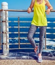 Healthy woman in fitness outfit looking aside at embankment Royalty Free Stock Photo