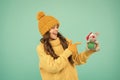 Look at this. happy girl pointing christmas toy. small kid in warm clothes hold gift. happy holiday. winter season Royalty Free Stock Photo