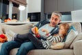 Emotional man and girl watching video on gadget Royalty Free Stock Photo