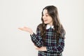 Look here. Product presentation. Small girl nice hairstyle. Child long curly hair. Happy schoolgirl stylish uniform