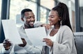 Look honey, loans all paid off. a young couple going through paperwork at home.