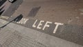 Look left words on pavement in London Oxford Street