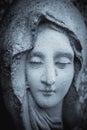 The look of love and eyes of Virgin Mary. Fragment of very old stone statue. Religion, faith, Christianity concept