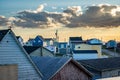 View of rooftops and East Coast homes overlooking a distant Atlantic sunset in Bonavista Newfoundland Canada