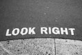 Look right sign painted on road advising care when stepping of path