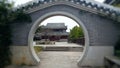 Look at the scenery through the round gate.