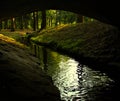 A look on a small river from under the bridge Royalty Free Stock Photo