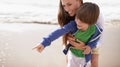 Look A starfish. a little boy pointing something out while on the beach with his mother. Royalty Free Stock Photo