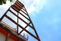 Look up on the steel stairs, sky background, clouds and sunlight. Royalty Free Stock Photo