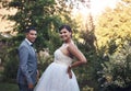 Look stunning on their special day. a young couple posing outside on their wedding day.