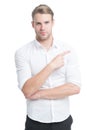 Look there. Man handsome smiling unshaven guy on white background pointing finger. Advertising concept. Advertising Royalty Free Stock Photo