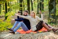 Look there. Relaxing in park together. Happy loving couple relaxing in park together. Couple in love tourists relaxing Royalty Free Stock Photo