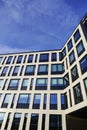 Look up to white building facade towards blue sky. Kopli, Tallinn, Estonia. February 2024 Royalty Free Stock Photo