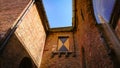 A Look At The Walls, Entrance And Roof Of An Ancient Brick Christian Church In Bruges, Belgium