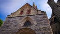 A Look At The Walls, Entrance And Roof Of An Ancient Brick Christian Church In Bruges, Belgium