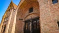 A Look At The Walls, Entrance And Roof Of An Ancient Brick Christian Church In Bruges, Belgium